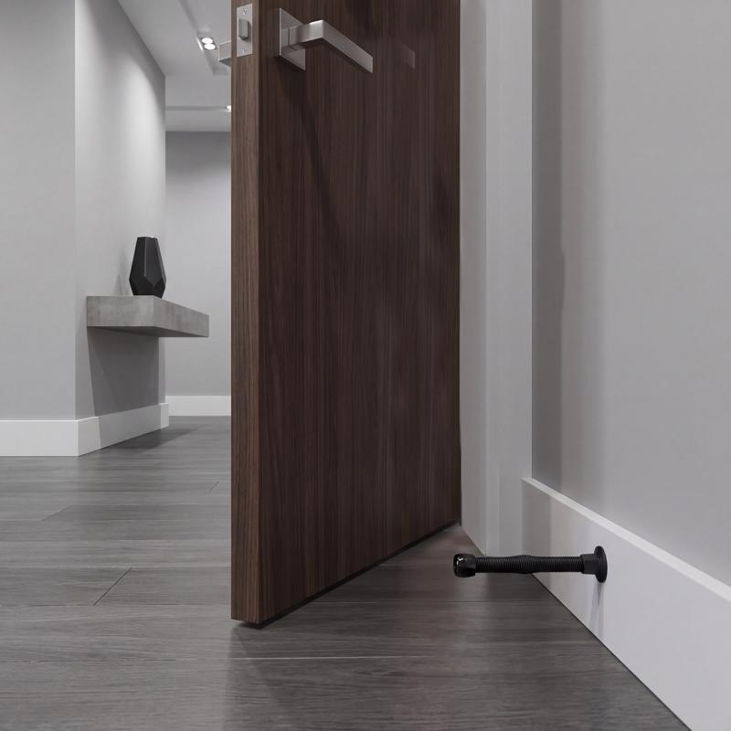 Ace Steel w/Plastic Tip Matte Black Spring Door Stop Mounts to base trim 0 in.